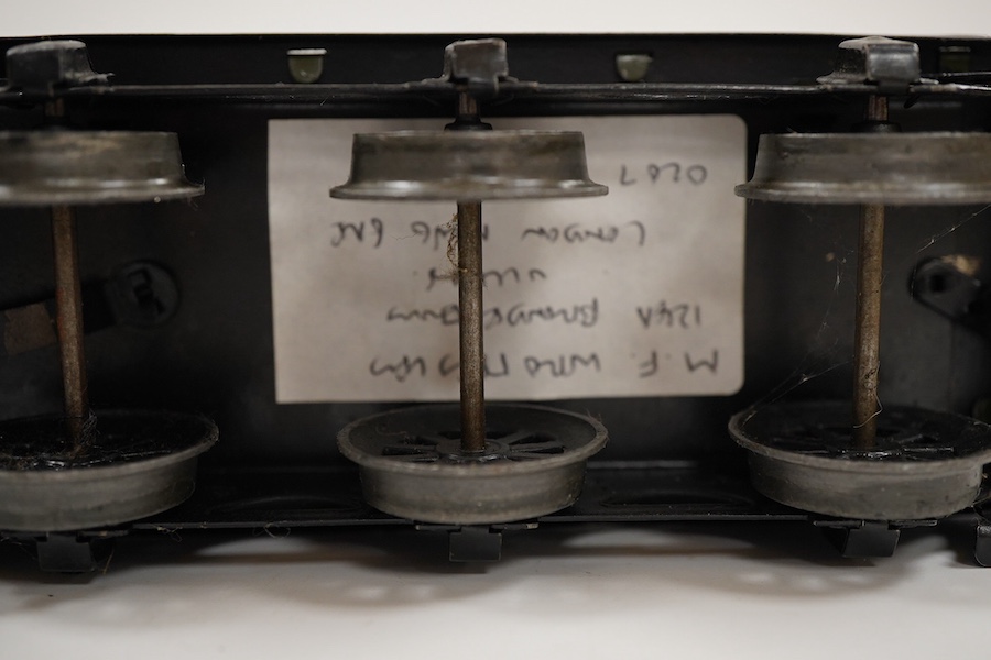 An 0 gauge Bassett-Lowke clockwork tinplate BR 4-4-0 tender locomotive, Prince Charles 62453, in dark green livery with orange and black lining and original clockwork mechanism